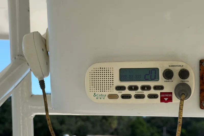 Slide: The Image of Marine radio on a 2021 Key Largo 2650WI boat, displaying channel 20. - 26