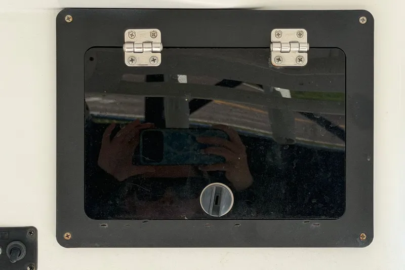 Slide: The Image of Hinged black panel on 2021 Key Largo 2650WI boat. - 28