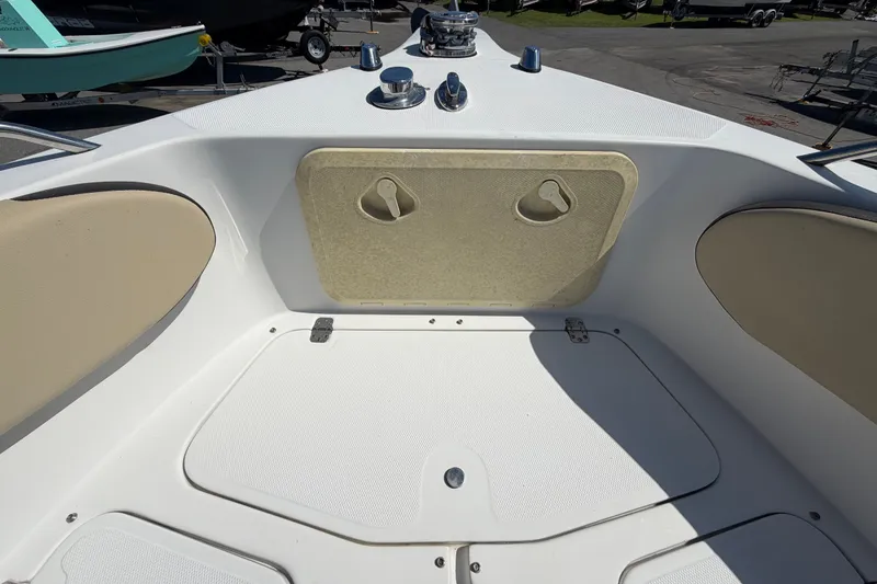Slide: The Image of 2021 Key Largo 2650WI boat deck with storage compartments and seating. - 47