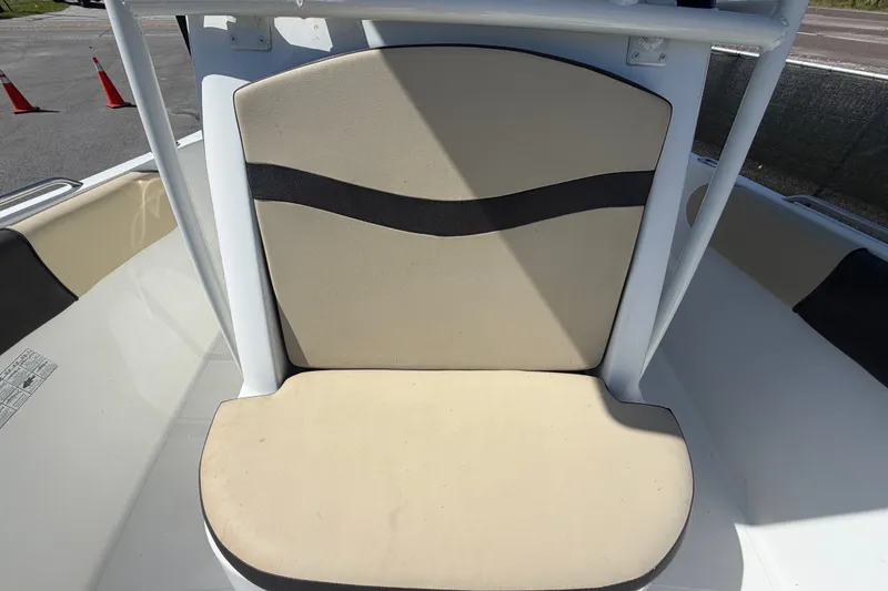 Slide: The Image of 2021 Key Largo 2650WI boat seat with beige and black upholstery. - 58