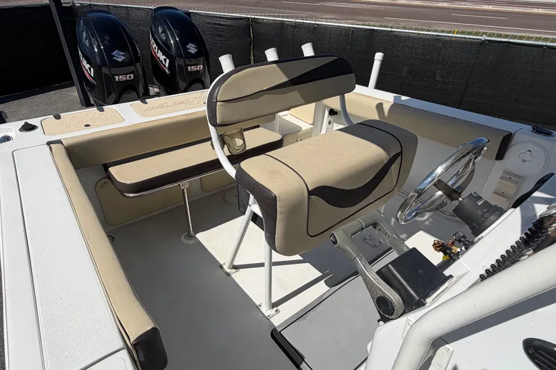 Slide: The Image of 2021 Key Largo 2650WI boat interior with dual Suzuki 150 engines. - 66