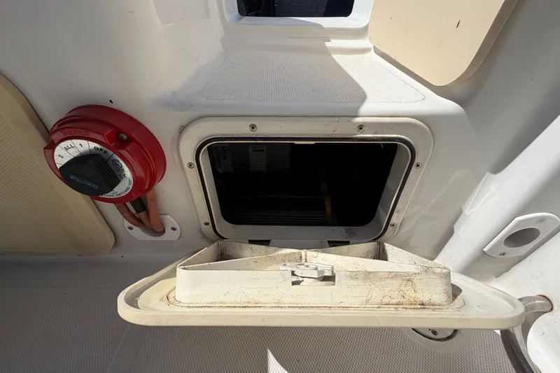 Slide: The Image of Open hatch and battery switch on 2021 Key Largo 2650WI boat. - 71