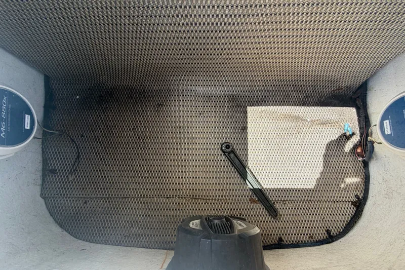 Slide: The Image of Interior view of a 2021 Key Largo 2650WI boat with textured flooring. - 60