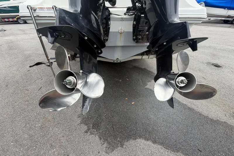 Slide: The Image of Twin outboard motors on a 2021 Key Largo 2650WI boat, showcasing propellers. - 3