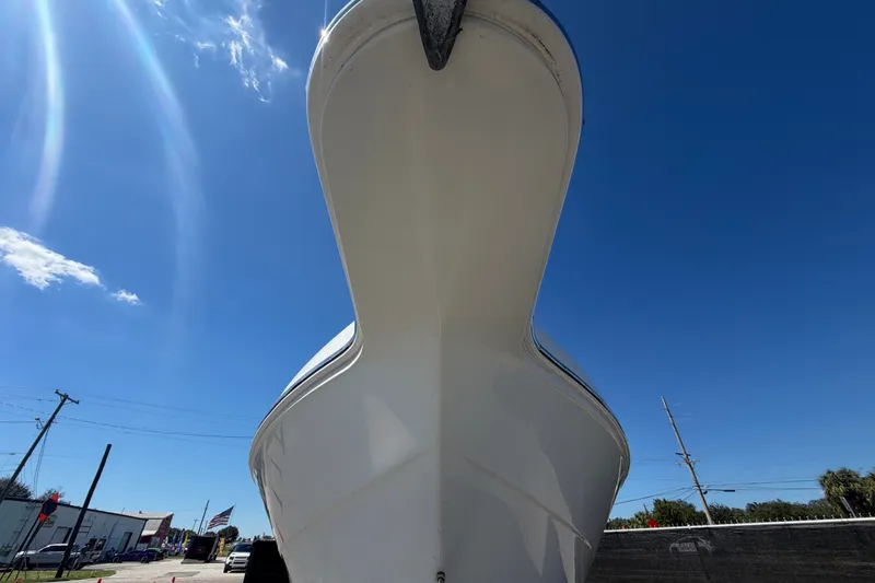 Slide: The Image of Key Largo 2650WI boat from 2021, viewed from below against a clear blue sky. - 15