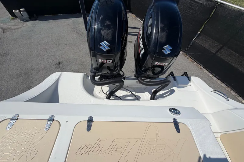 Slide: The Image of 2021 Key Largo 2650WI boat with dual Suzuki 150 outboard motors. - 78
