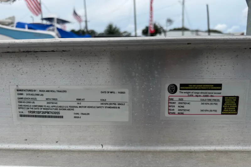Slide: The Image of Trailer information label with tire specifications and manufacturing details, Key Largo 2650WI, 2021 model. - 22