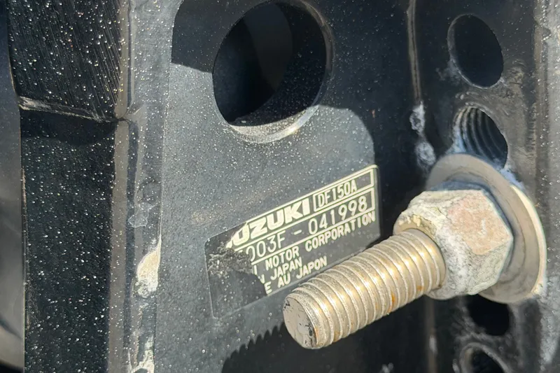 Slide: The Image of Close-up of Suzuki DF150A motor label on Key Largo 2650WI, 2021 model. - 83