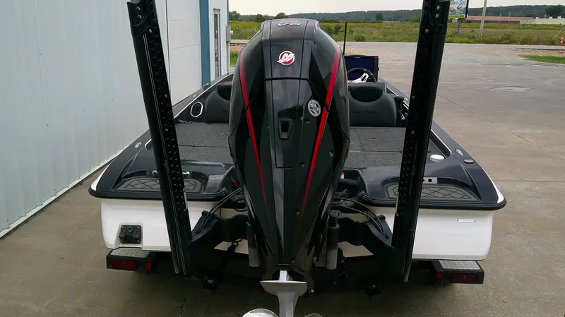 Slide: The Image of The image shows a 2025 Caymas CX 21 PRO boat with a powerful outboard motor. - 5