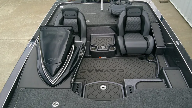 Slide: The Image of The image shows the cockpit of a 2025 Caymas CX 21 PRO boat with two cushioned seats. - 16