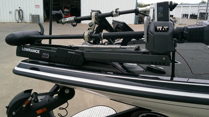 Slide: The Image of The image shows a modern boat with a Lowrance trolling motor, sitting on a trailer. - 17
