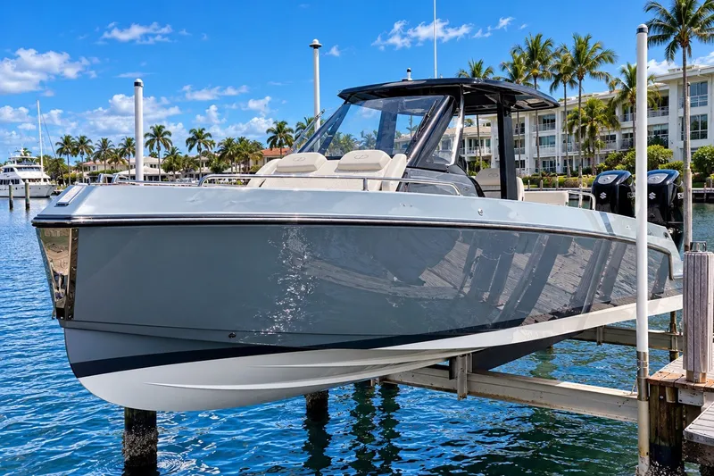The Image of 2022 Schaefer V33 boat docked in a sunny marina with palm trees. - 0