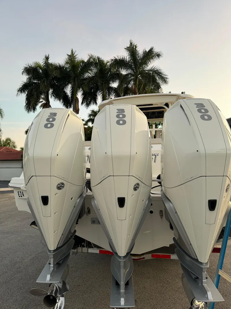 Slide: The Image of 2021 Boston Whaler 350 Outrage with triple outboard engines. - 50