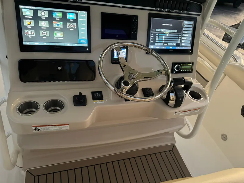 Slide: The Image of Boston Whaler 350 Outrage 2021 helm with advanced navigation and control systems. - 40