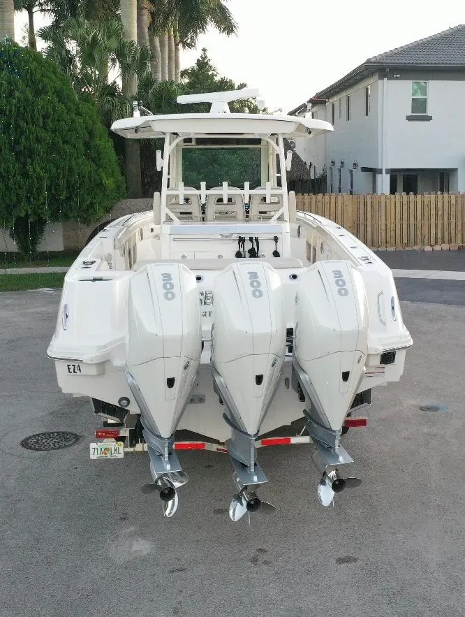 Slide: The Image of 2021 Boston Whaler 350 Outrage with triple outboard engines. - 4