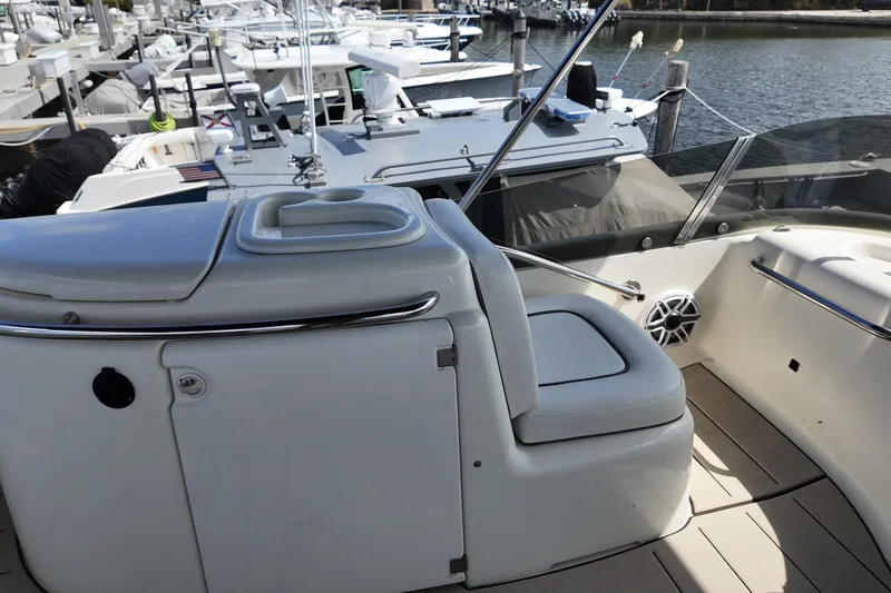 Slide: The Image of 2007 Cranchi Atlantique 40 yacht interior with seating and docked boats in background. - 26