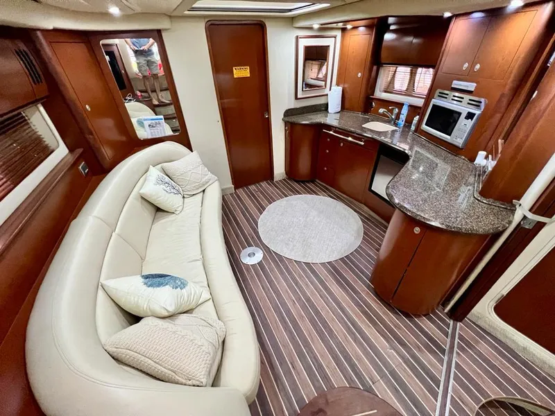 Slide: The Image of Luxurious 2007 Sea Ray 44 Sundancer yacht interior with elegant seating and modern kitchen. - 28