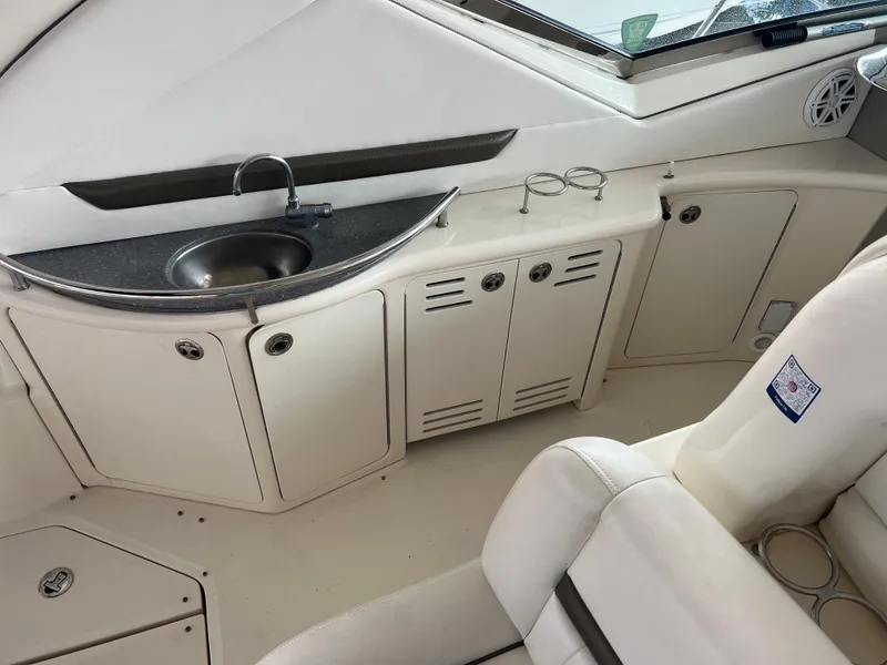Slide: The Image of Interior view of 2007 Sea Ray 44 Sundancer yacht with sink and storage cabinets. - 19