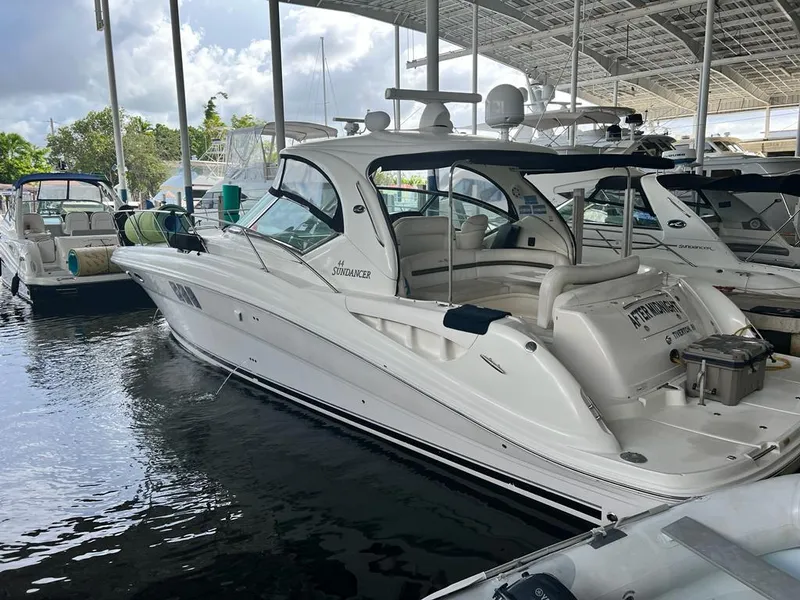 Slide: The Image of 2007 Sea Ray 44 Sundancer yacht docked in a marina. - 18