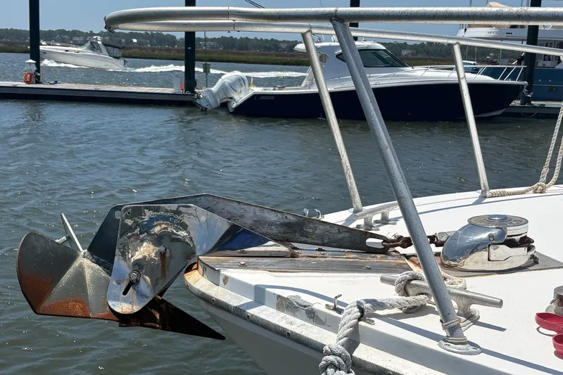 Slide: The Image of Bow of 1989 Topaz 44 Sportfisherman with anchor and winch, docked in marina. - 5