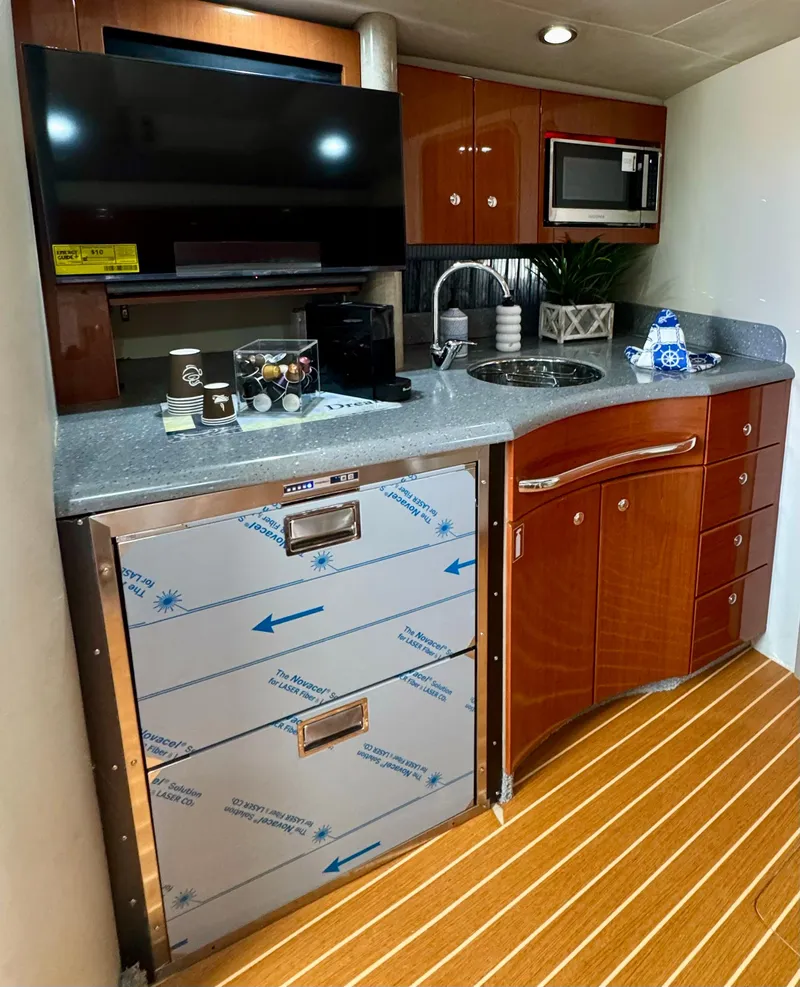 Slide: The Image of 2006 Formula 40pc yacht kitchen with modern appliances and wood cabinetry. - 10