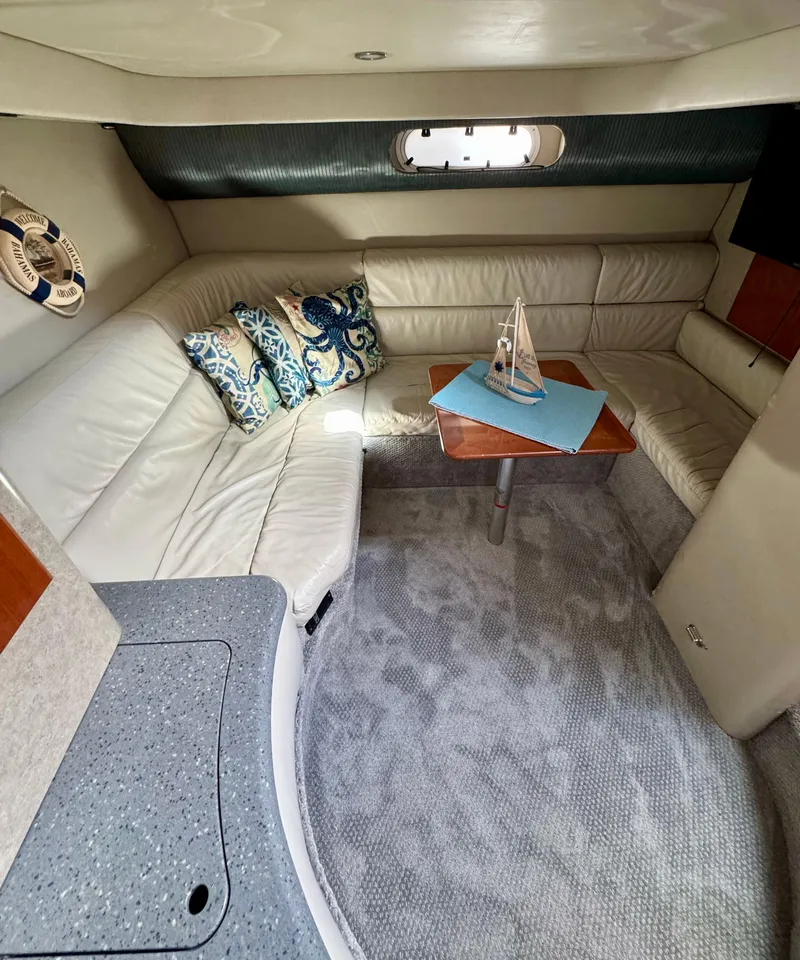 Slide: The Image of Interior of a 2006 Formula 40pc yacht with plush seating and decorative pillows. - 15