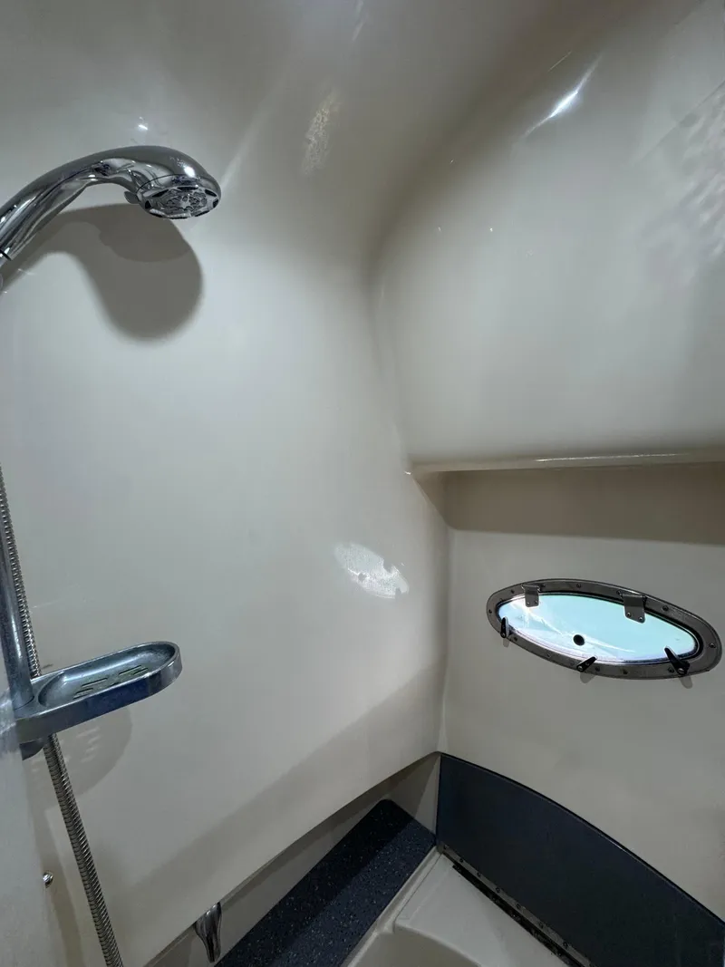 Slide: The Image of 2006 Formula 40pc yacht bathroom with shower and porthole window. - 21
