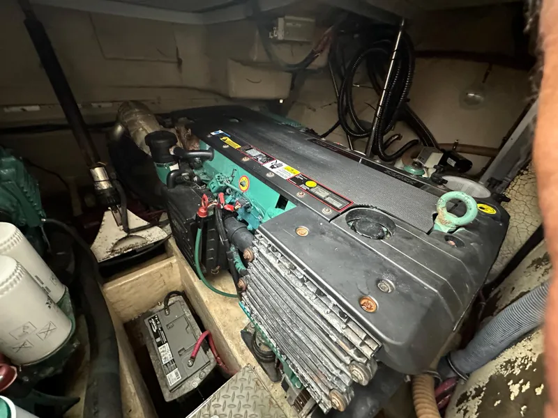 Slide: The Image of Engine compartment of a 2006 Formula 40pc boat, featuring visible components and wiring. - 34