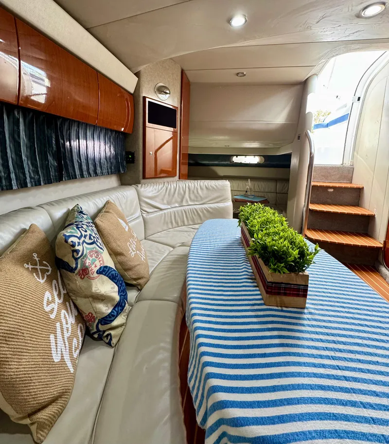 Slide: The Image of Interior of a 2006 Formula 40pc yacht with cozy seating and decorative pillows. - 12