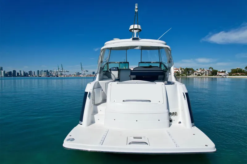 Slide: The Image of 2006 Formula 40 Performance Cruiser on calm water with city skyline in background. - 44