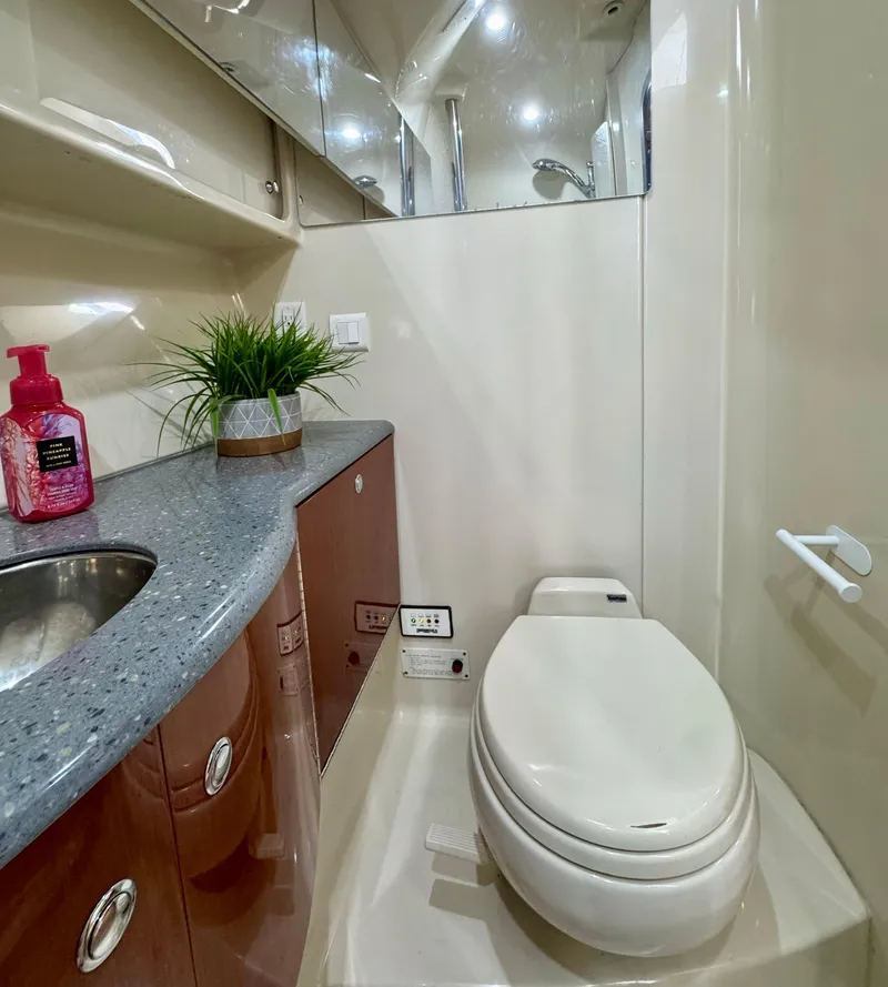 Slide: The Image of Luxurious bathroom in a 2006 Formula 40pc yacht with modern amenities and sleek design. - 18