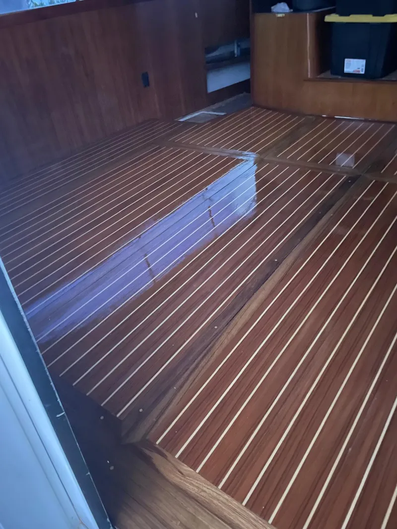 Slide: The Image of Polished wooden interior floor of a 1997 Ocean Yachts 40 Super Sport. - 19