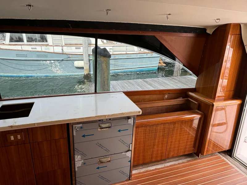 Slide: The Image of Interior of 1997 Ocean Yachts 40 Super Sport with wooden cabinetry and waterfront view. - 20