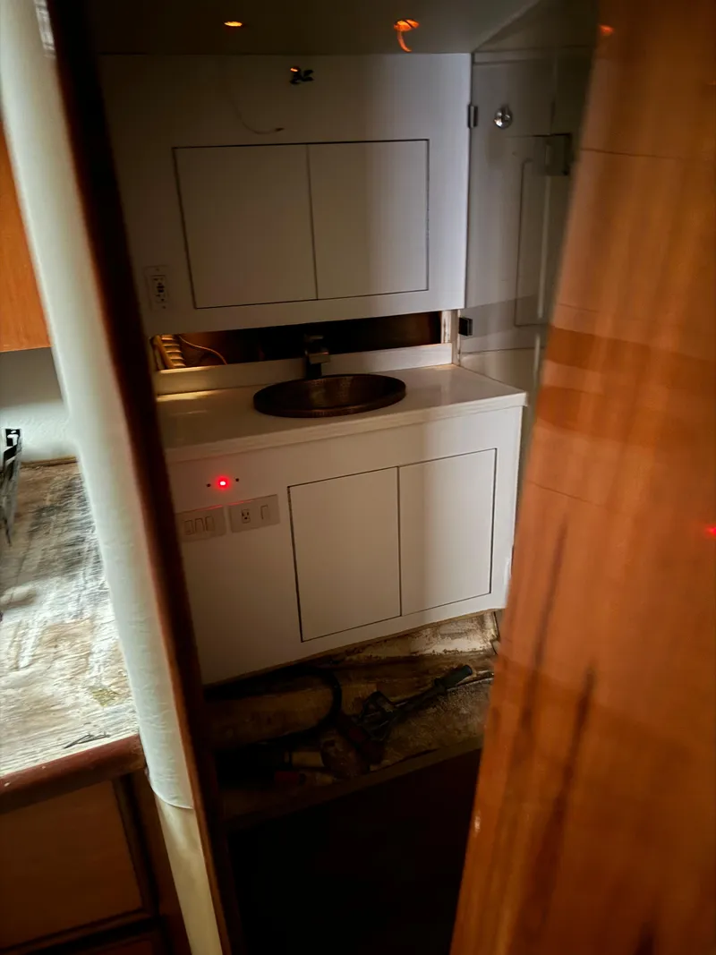 Slide: The Image of Interior of 1997 Ocean Yachts 40 Super Sport with sink and cabinets. - 21