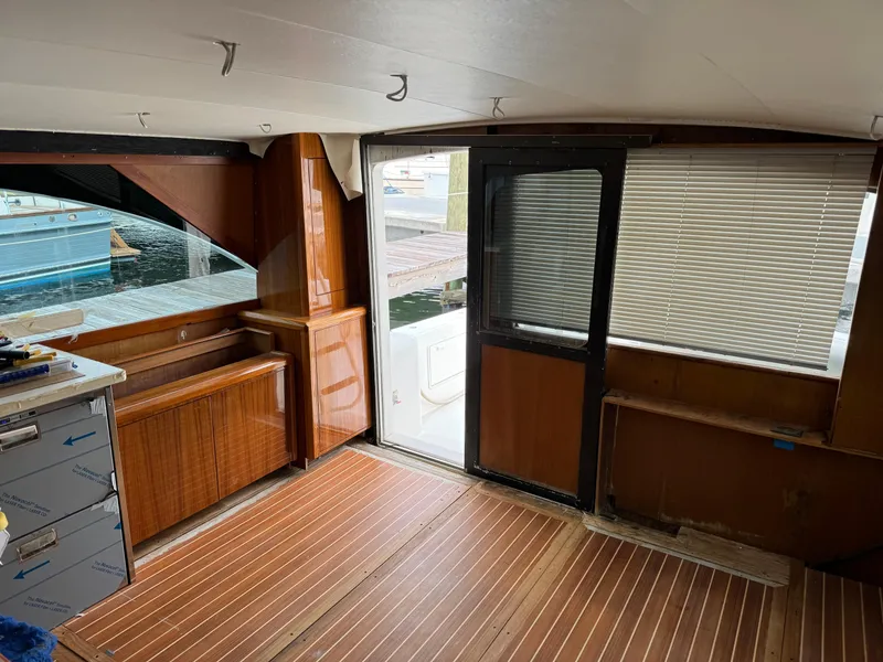 Slide: The Image of Interior of 1997 Ocean Yachts 40 Super Sport with wooden flooring and dock view. - 26
