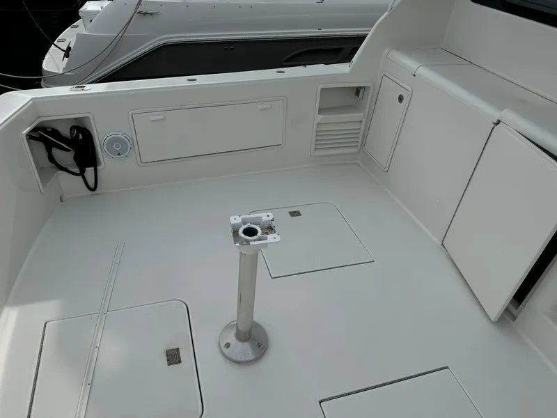 Slide: The Image of 1997 Ocean Yachts 40 Super Sport boat deck with storage compartments and pedestal mount. - 15