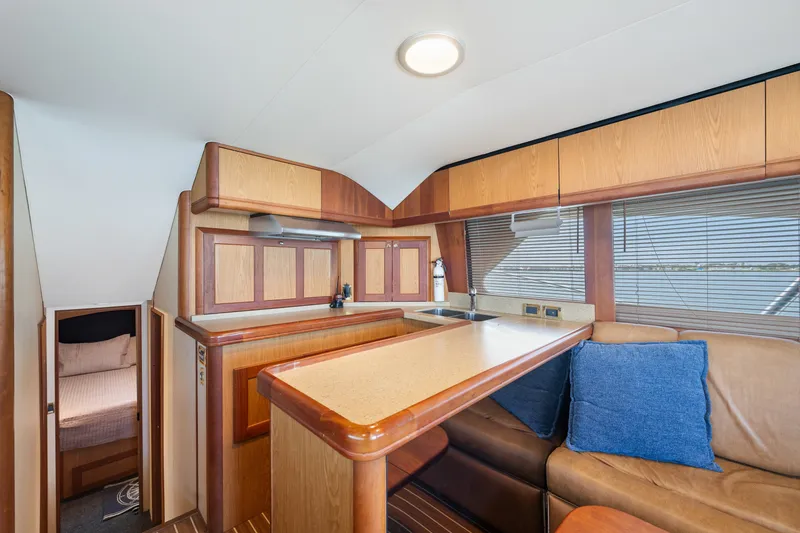 Slide: The Image of Interior of 2005 Luhrs 41 Convertible yacht with kitchen and seating area. - 10