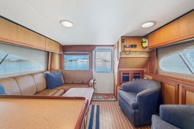 Slide: The Image of Luxurious interior of 2005 Luhrs 41 Convertible yacht with plush seating and wood accents. - 14