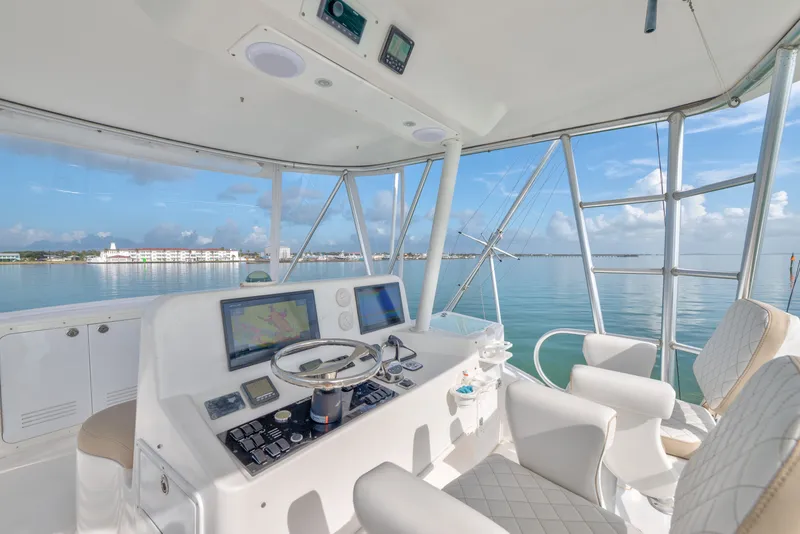 Slide: The Image of Helm of 2005 Luhrs 41 Convertible yacht with ocean view and navigation equipment. - 20