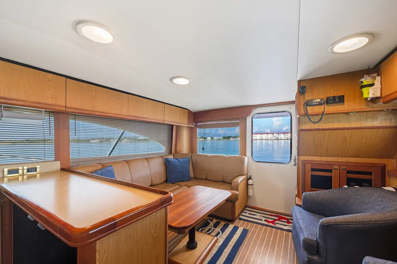 Slide: The Image of Luxurious interior of 2005 Luhrs 41 Convertible yacht with leather seating and wood accents. - 13