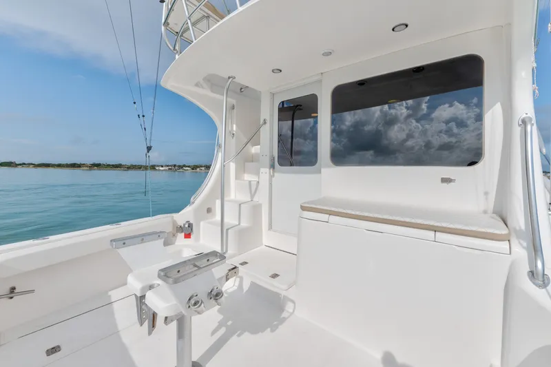 Slide: The Image of 2005 Luhrs 41 Convertible yacht deck with seating and ocean view. - 28
