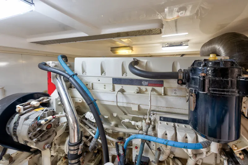Slide: The Image of Engine room of 2005 Luhrs 41 Convertible yacht, showcasing mechanical components and wiring. - 35