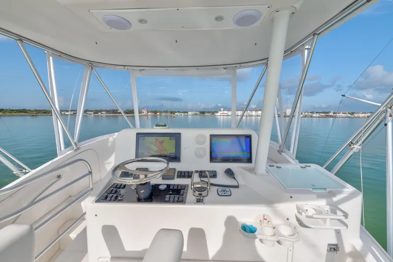 Slide: The Image of 2005 Luhrs 41 Convertible yacht helm with navigation screens and ocean view. - 21