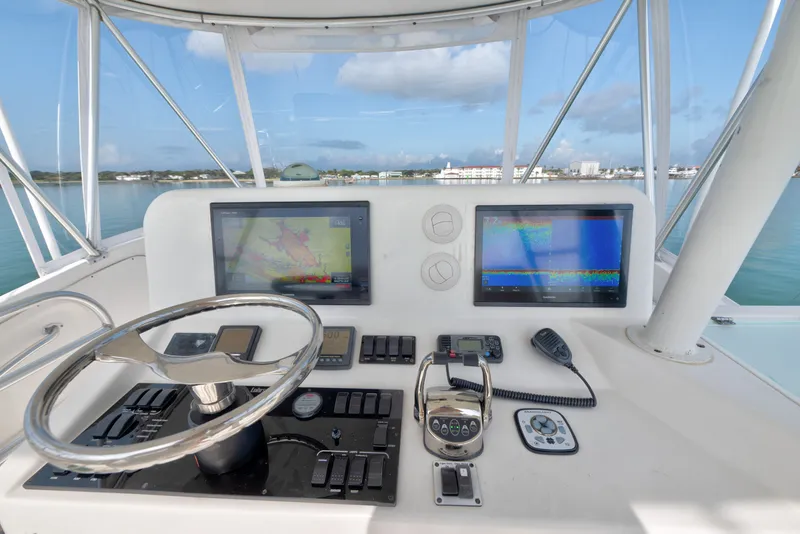 Slide: The Image of Helm of 2005 Luhrs 41 Convertible yacht with navigation screens and controls. - 22