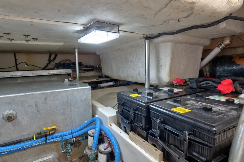 Slide: The Image of Engine room of 2005 Luhrs 41 Convertible with batteries and wiring visible. - 39
