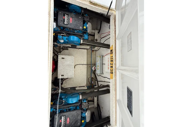 Slide: The Image of Engine compartment of a 2003 Gibson 5500 SERIES boat with Crusader engines. - 13