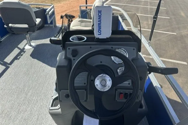Slide: The Image of 2027 Sun Tracker Bass Buggy 18 DLX pontoon boat dashboard with Lowrance navigation system. - 13