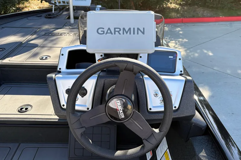 Slide: The Image of Steering console of 2027 Tracker Savage 215 boat with Garmin navigation system. - 21