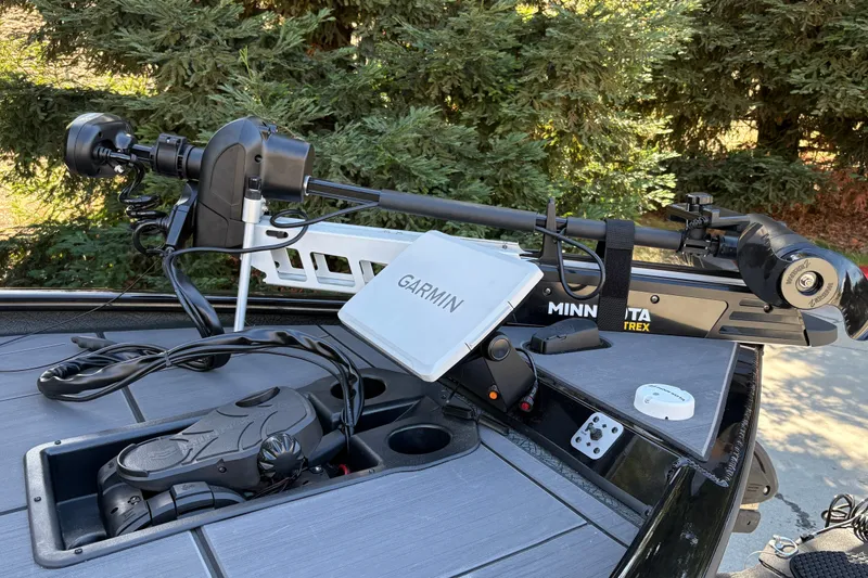 Slide: The Image of 2027 Tracker Savage 215 boat with Minn Kota trolling motor and Garmin navigation system. - 14