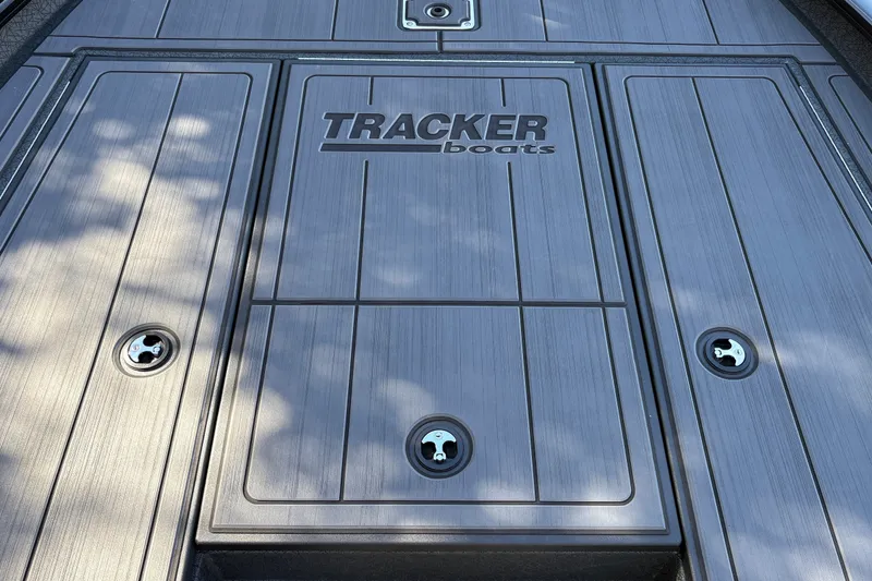 Slide: The Image of 2027 Tracker Savage 215 boat deck with sleek design and secure latches. - 31